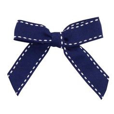 a blue bow with white dots on it