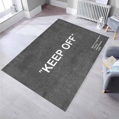 a rug with the words keep off on it in front of a couch and radiator