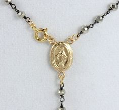 This is the stunning 14kt gold filled rosary inspired necklace.  This is an 18" necklace made of 2-3mm faceted Pyrite Gemstones on 24kt Gold Vermeil.  The clasp closure connects at the center Miraculous Medallion.  Necklace drop measures 2 1/2" and includes a 14kt Gold filled cross that measures 3/4".  You may order this necklace with the clasp closure in back by leaving a note at checkout.  Comes nicely boxed for the perfect gift!  This necklace may be ordered in all Pyrite on Gold chain, see l Rosary Inspired Necklace, Gold Rosary Necklace, 14kt Gold Jewelry, Rosary Gift, Gold Rosary, Clean Sterling Silver, Inspired Necklace, Rosary Necklace, Medallion Necklace