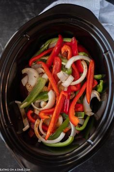 a bowl filled with vegetables on top of a table