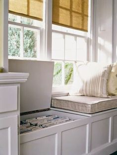 a laptop computer sitting on top of a window sill