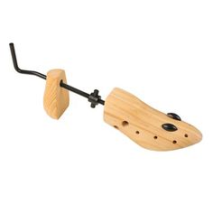 a wooden toy with a black handle on it's end and a white background