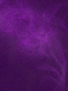 an abstract purple background with black spots