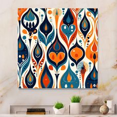 an orange and blue abstract painting hanging on a wall above a white fireplace mantel