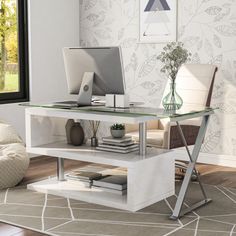 a computer desk with a glass top and metal legs