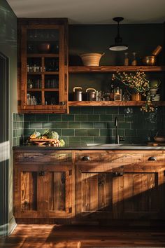 a kitchen with green tile and wooden cabinets