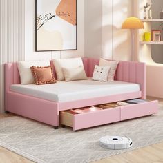 a living room with a pink couch and ottoman