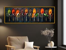 spoons are lined up on the wall above a chair