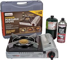 the portable stove has two burners and is next to it's cleaning supplies