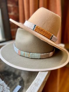 One of a kind hand woven hatbands in beautiful boho colors and patterns.  Hand woven by me on a wooden loom using luxurious fibers like linen, cotton, raw silk, bamboo and hand spun yarn. Perfect for that Fedora or summer straw hat . Price is per hat band. Standard fedora size (23 1/2 inches long) width is about 3/4 of an inch but can be woven to any size specifications. Always open to custom color & design ideas! You can shoot an email inquiring what is currently in stock, send me a screenshot Artisan Handwoven Wide Brim Fedora, Artisan Woven Flat Brim Hats, Handwoven Brown Hat Bands With Curved Brim, Artisan Woven Hats With Short Brim, Artisan Handwoven Brimmed Fedora, Artisan Handwoven Adjustable Fedora, Bohemian Handmade Fedora With Curved Brim, Handmade Bohemian Fedora With Curved Brim, Brown Woven Bohemian Straw Hat