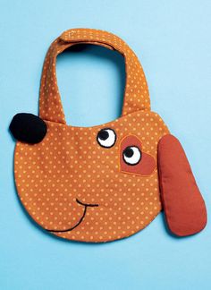 an orange bag with a dog face on it