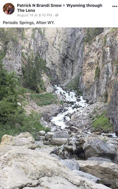 an image of a stream in the middle of a rocky mountain side with trees and rocks