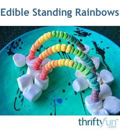 edible standing rainbows on a plate with marshmallows