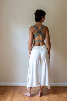 A top-selling tank from our shop for over a decade, this strappy yoga tank is made from the highest quality sustainably sourced cotton lycra blend.  The woven back adds a unique flair. Great for yoga, pilates & dance. Also looks amazing under backless tops. Paramita Designs clothing makes for excellent travel wear on your next adventure! Shown here in Sage with the white Mini Skirt and Ruffle Pants. Hand or machine wash cold delicate cycle. While drying on a gentle cycle will not damage the top, the longevity of the top will be maintained by hanging to dry.  Fair Trade - Handmade - Sustainable Hippie Yoga Outfits, Yoga Outfit Aesthetic, Boho Yoga Outfit, Yoga Outfits For Women Fashion, Yoga Skin, Yoga Outfits For Women, Yoga Chic, Hot Yoga Outfit, Pilates Wear