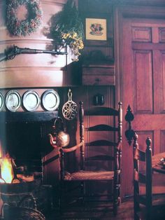 an old fashioned dining room with wooden chairs