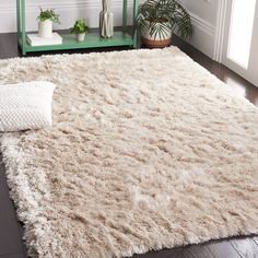 a white rug on the floor in a living room