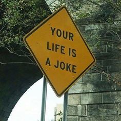 a yellow sign that says your life is a joke