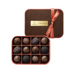 an open box of chocolates with a ribbon around it