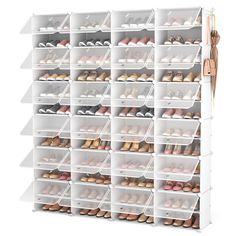 the shoe rack is filled with many pairs of shoes and has multiple bins for each pair