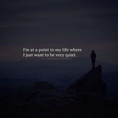 a person standing on top of a mountain with the words i'm at a point in my life where i just want to be very quiet