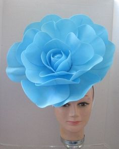 "*  This large smooth turquoise open faced flower has a diameter of 13\" when it is fully expanded. *   The flower sits off to the right side of the head and is tilted forward for a more dramatic look.  The tilt can be adjusted by wearing the band further back on the head. *  The back of the flower has a puff of pale turquoise colored feathers that makes the design closer to a custom piece of work. *  It has been made on a white satin covered acrylic headband that offers great support and stabil Flower Hat, Pale Turquoise, Alice In Wonderland Costume, Wonderland Costumes, Crown Hat, Crazy Hats, Turquoise Flowers, Dramatic Look