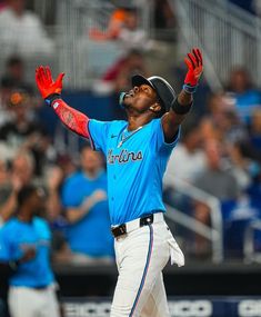 a baseball player catching a ball in the air