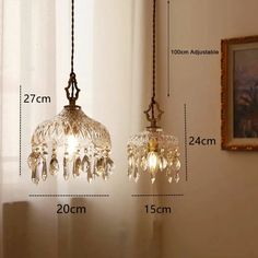 an image of two chandeliers hanging from the ceiling with measurements for each one