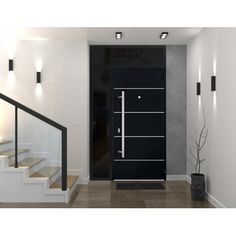 a black door in a white room with stairs