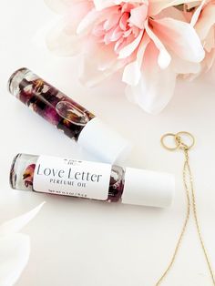 Love Letter perfume oil's floral scent has hints of citrus, amber, and musk. It's a perfect choice for those seeking a romantic, feminine scent that won't overpower the senses. Infused with red rose petals for a glamorous look.  Our perfume oils come in a glass rollerball, perfect for taking on the go. Net Wt 0.3 oz / 8.5 g   Directions: apply oil to neck and wrists using circular motions with the rollerball applicator. Ingredients: fractionated coconut oil, fragrance, dried botanicals. Dried Botanicals, Red Rose Petals, Roll On Perfume, Mens Items, Roller Bottle, Perfume Oil, Fractionated Coconut Oil, Fall Gifts, Spray Tanning