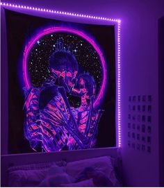 a bedroom with purple lights and a skeleton painting on the wall, in front of a bed