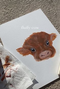 a book with an image of a brown cow on it's cover and the title fluffy cow written in white