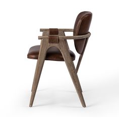 a chair made out of wood and leather with a wooden frame on the armrests