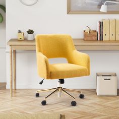 a yellow office chair sitting on top of a wooden desk next to a book shelf