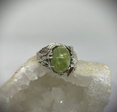 Unique piece Sterling silver set with a superb green prehnite.  This unique soft leaf ring was sculpted in wax and then cast in sterling silver.  For nature lovers!  Stone 10 x 14 mm  Size 9 US  If you want another size or another stone, let me know, and I can do it, but each ring and each stone is unique and a little different! Unique piece, very original!  Prehnite:  Used during questioning, prehnite helps bring order to projects and ideas and stimulates the mind to start new actions. A deeply soothing stone, it promotes calm before meditation and allows you to reach a state of calm before any magical work. It is also the stone of joy of living and optimism.  MESSAGE TO RESIDENTS OF QUEBEC: The amount of Federal and Provincial taxes is included in the sale price and the amounts will not Ring Green Stone, Silver Leaf Ring, Green Stone Ring, Green Stone Rings, Joy Of Living, Leaf Ring, I Can Do It, Multi Stone Ring, Sterling Silver Bands