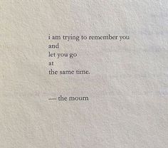 an old typewriter with the words i am trying to remember you and let you go at the same time