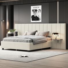 a bedroom with a bed, nightstands and pictures on the wall