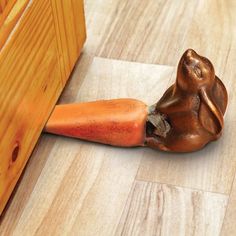 a piece of wood that has been placed on the floor with a hammer in it