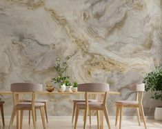 a dining room with marble walls and wooden chairs