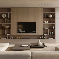 a living room filled with furniture and a flat screen tv