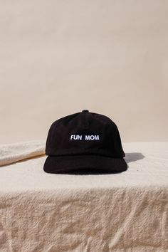 "Im not like a regular mom , I'm a fun mom." Intentionally Blank "Fun Mom" hat saying it all for you. cool mom One size. Adjustable back. Hand embroidered in LA. PIPE AND ROW Adjustable Curved Brim Fun Dad Hat, Fun Hats With Embroidered Logo One Size, Fun Hats With Embroidered Logo, Fun Embroidered Logo Hat One Size, Fun Black Cotton Baseball Cap, Adjustable Fun Dad Hat For Streetwear, Fun Adjustable Dad Hat For Streetwear, Fun Embroidered Logo Baseball Cap, Fun Baseball Cap With Embroidered Logo