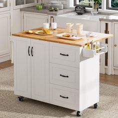 a kitchen island cart with food on it