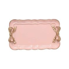 a pink tray with gold trimmings and bows on the edge is shown in front of a white background