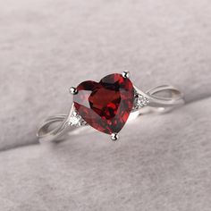 ◆ The ring is handcrafted from sterling silver and decorated with a dazzling 8*8 mm garnet and CZs. It is suitable for engagement/anniversary/daily occasion. ◆ Production Description: Main stone Type: Natural Garnet Main Stone Shape: Heart Cut Main Stone Size: 8*8 mm(2.44ct) Side stone: CZ Metal: 925 Sterling silver - Other options available in the drop down menu ◆ Customization: √Free for Add Engraving √Other Metal Type Available √Other Gemstones & Shapes Available √Personalization Requests Ava Garnet Heart Ring, Silver Birthstone Ring With Prong Setting For Valentine's Day, Gift Rings With Center Stone And Lab-created Ruby, Silver Birthstone Ring For Valentine's Day, Gift Rings With Lab-created Ruby Center Stone, Valentine's Day Silver Birthstone Ring With Prong Setting, Elegant Heart Cut Lab-created Ruby Ring, Garnet Birthstone Promise Ring In Fine Jewelry Style, Garnet Solitaire Birthstone Ring For Anniversary