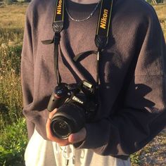 a man holding a camera in his hands