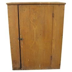 an old wooden cabinet with metal handles