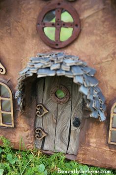 a close up of a small house made out of wood