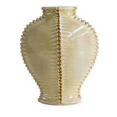 a white vase with gold trimmings on the bottom and sides, sitting on a white surface