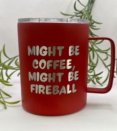 a red coffee mug with the words might be coffee might be fireball on it