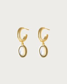 Sass up your lobes with some pure luster. These gold hoop earrings, adorned with the lustrous natural stone—Mother of Pearl—showcase a crystal radiance that reflects the calm and beauty of the sea. Move your head and let its iridescent shimmer captivate, always ready to step into a world where love flows as freely as t En Route Jewelry, Hard Metal, Instagram Tags, The Calm, Pearl Flower, Gold Hoop, Gold Hoop Earrings, Secret Santa, Gold Gold