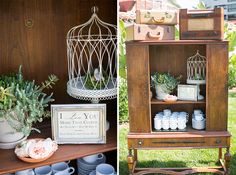 an old wooden cabinet with plants and other items on it, next to a birdcage filled with teacups